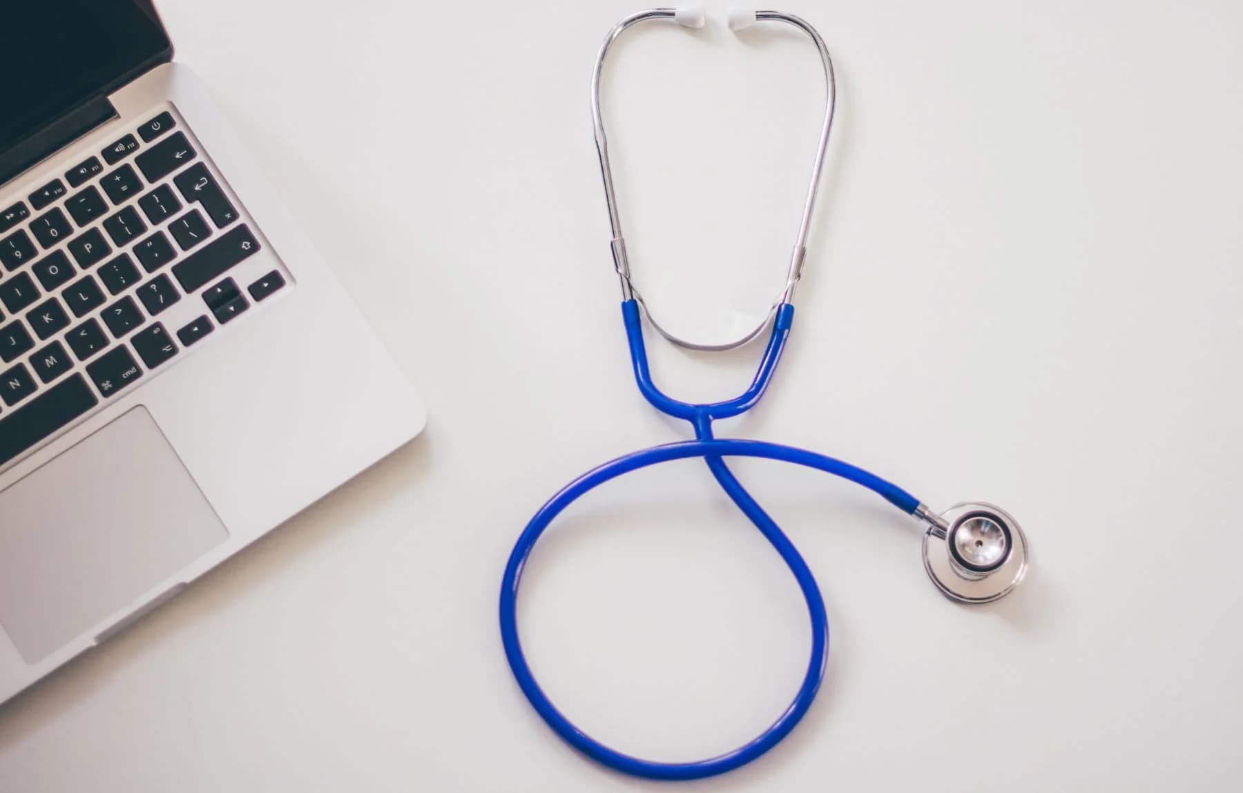 A stethoscope on a clean medical workspace